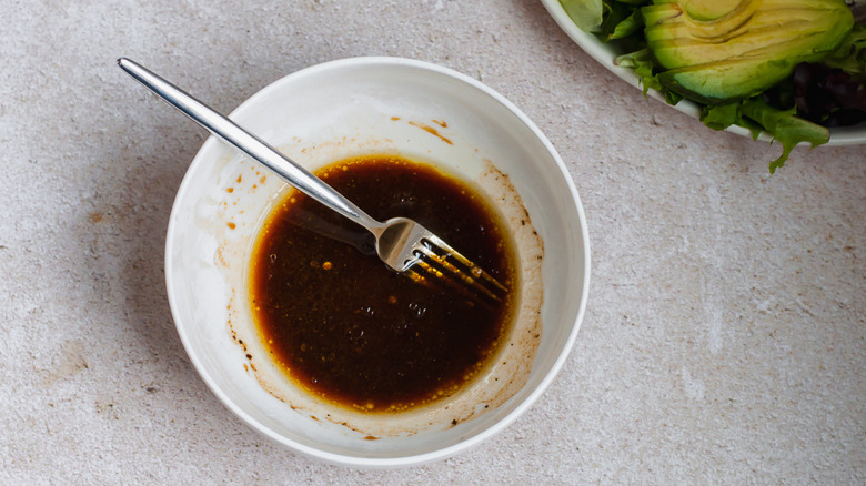 salad dressing in bowl with fork