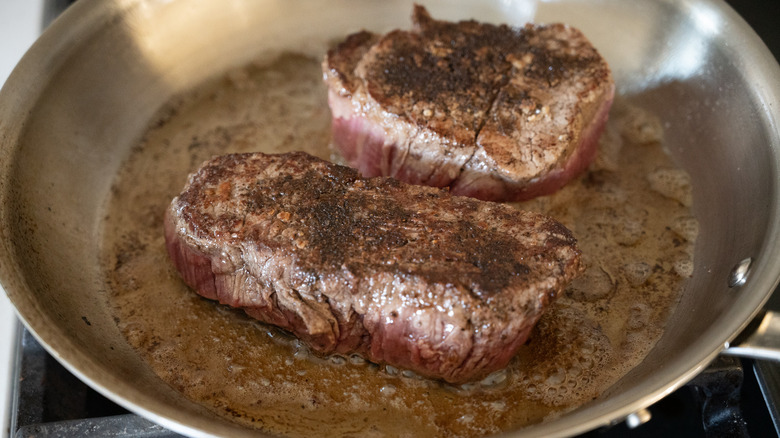 filet mignon steaks in pan
