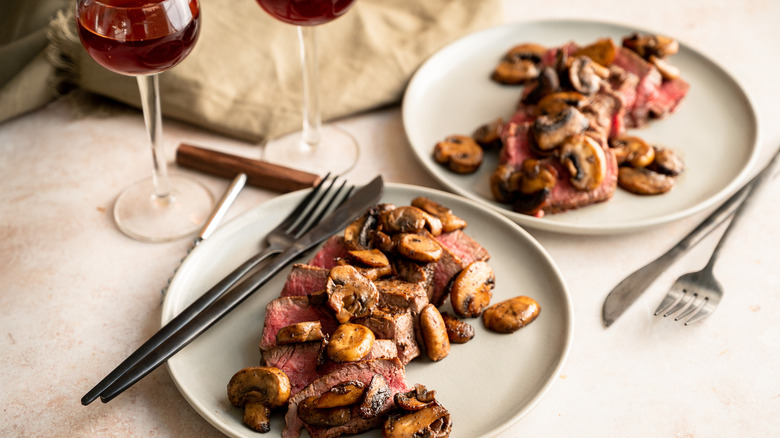 sliced steaks with sauteed mushrooms