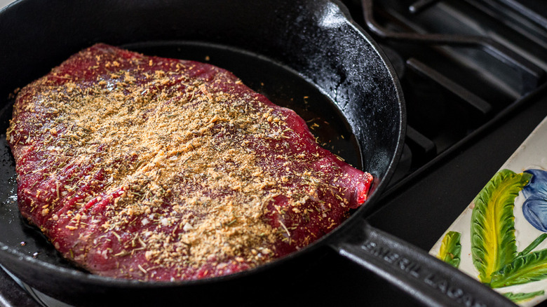 steak cooking in skillet