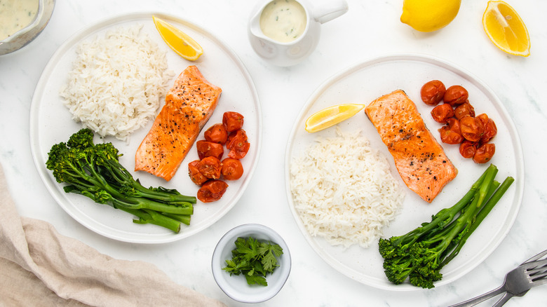 plates with trout, rice, veggies