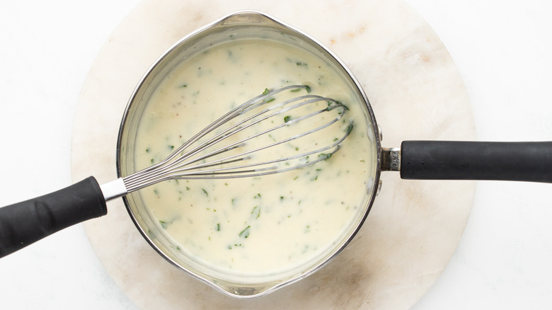 creamy parsley sauce in pan