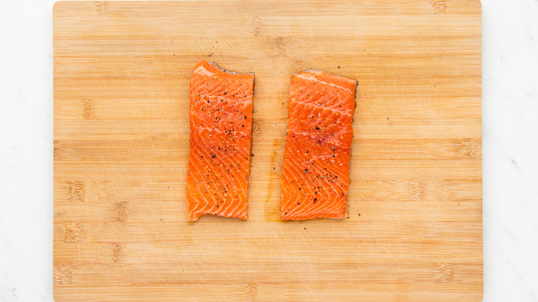 seasoned trout fillets on cutting board