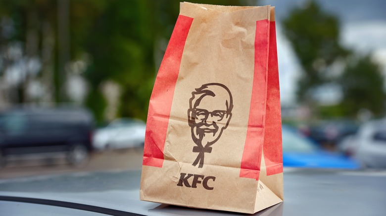 KFC bag on car hood