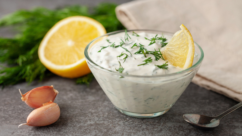 Small bowl of mayonnaise with garlic, herbs, and lemon