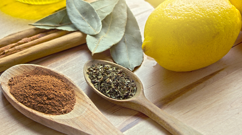 spices and a lemon on a wood table