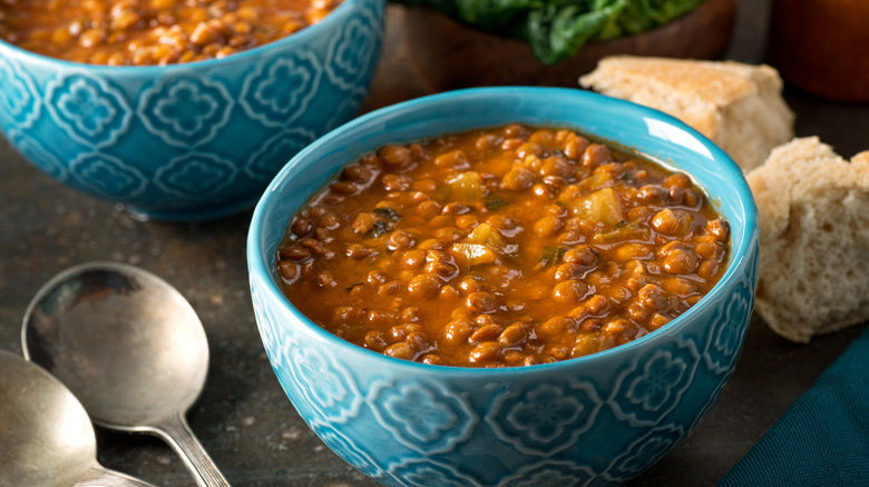 two blue bowls of soup