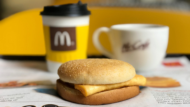 egg sandwich with coffee in the background