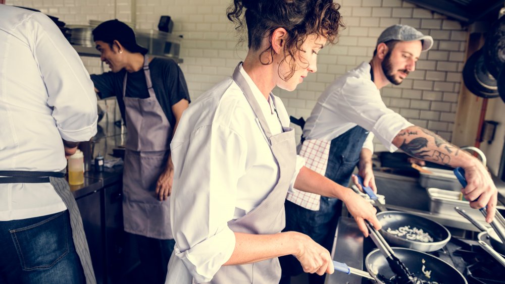 restaurant cooks work while sick