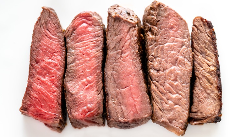 Slices of steak at different levels of doneness