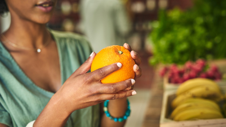 woman examining store produce