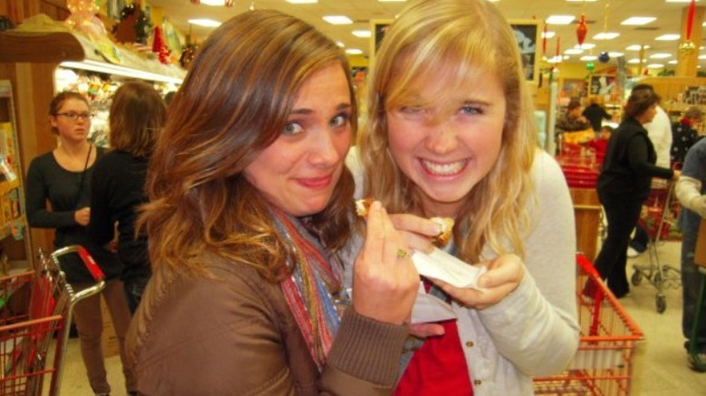 girls trying Trader Joe's bakery samples