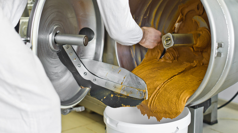 Workers processing peanut butter