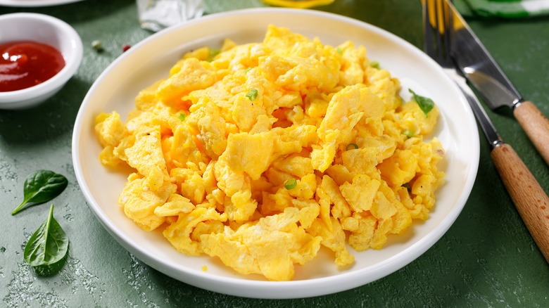 scrambled eggs on white plate