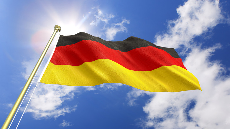 German flag against blue sky