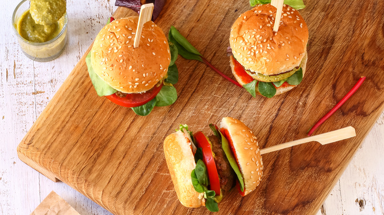 Mini burgers on a wooden board 