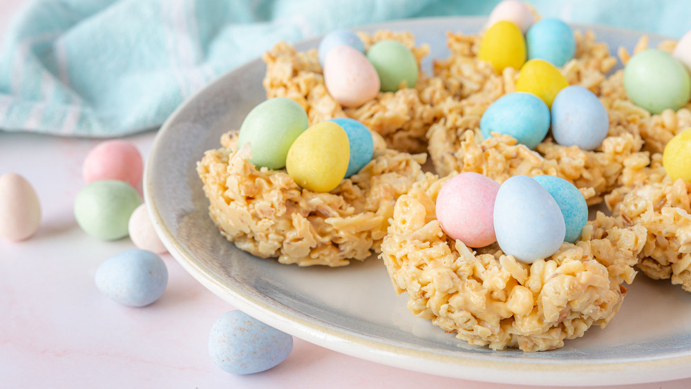 Bird's nest cookies with pastel colored chocolate speckled eggs