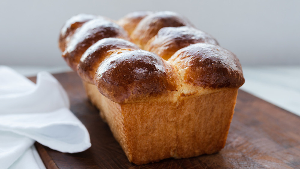 loaf of Brioche bread on cutting board