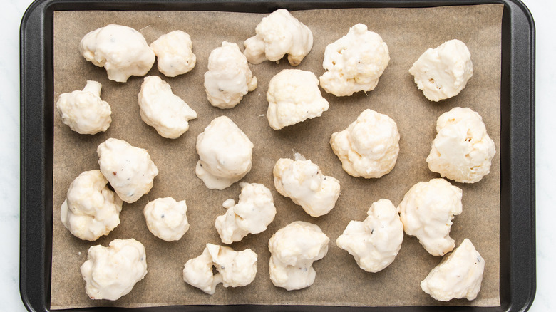 Cauliflower florets on baking sheet