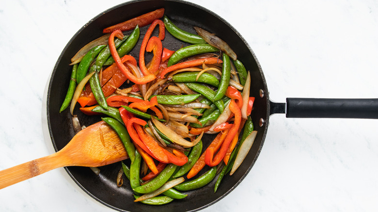 Vegetables stir frying on pan