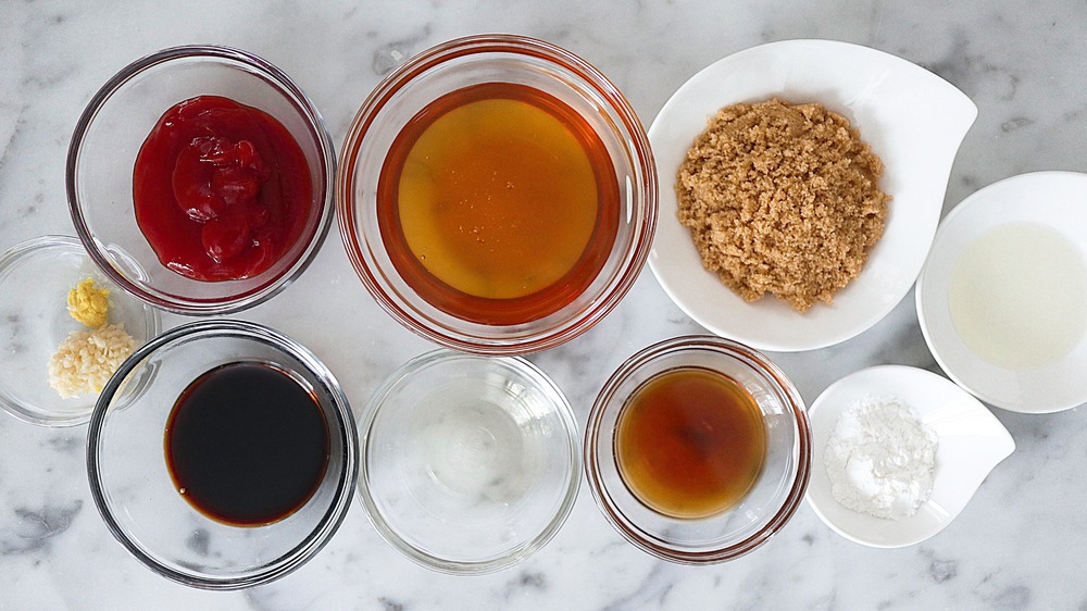 sesame sauce ingredients in glass and ceramic ramekins