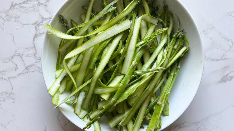 shaved asparagus salad prep on plate