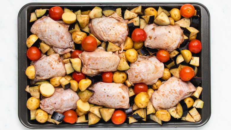 Chicken and veg on baking sheet