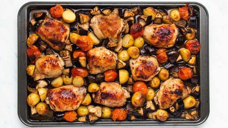 Sheet pan chicken and veg on baking sheet