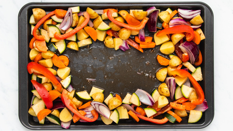 Marinated veggies on baking sheet