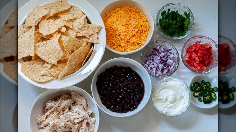 nacho ingredients on white surface