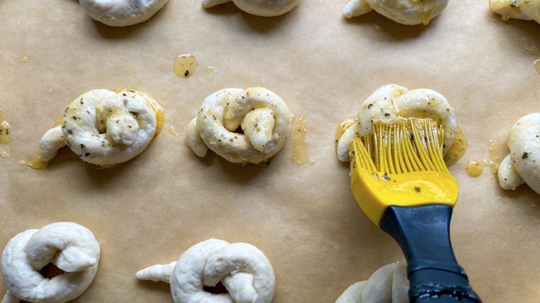 brush dough with buttery spread