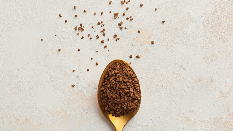 instant coffee granules on spoon