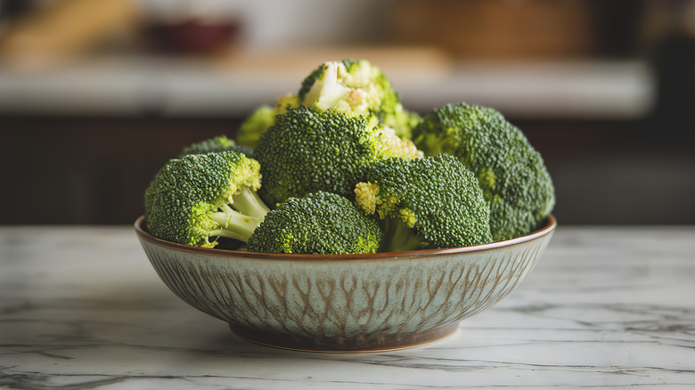 Broccoli in bowl on marble counter