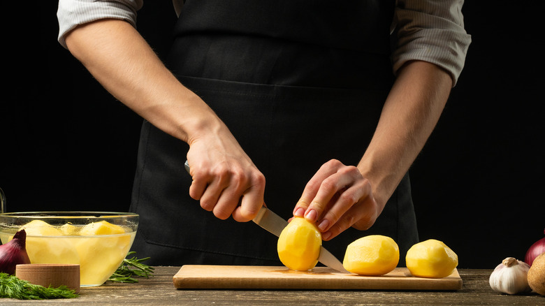 Chef preparing potatoes