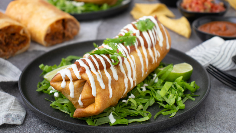 shredded beef chimichanga topped with sour cream