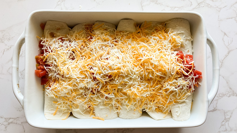 prepped enchiladas in baking dish