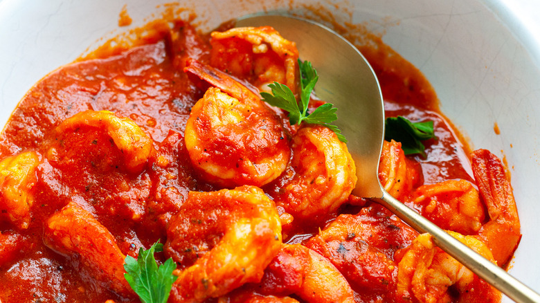 shrimp and red sauce in bowl