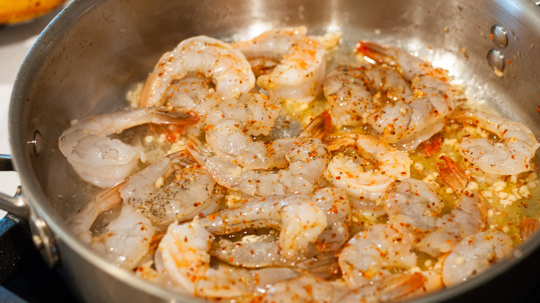 shrimp cooking in skillet