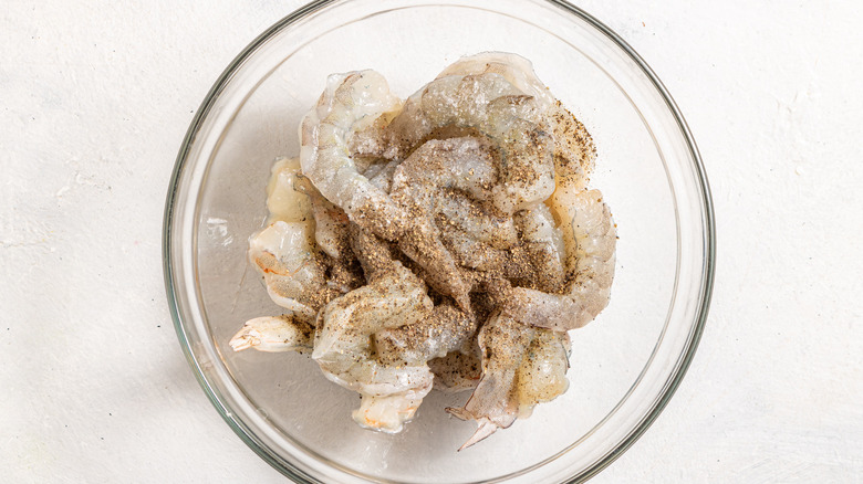 Bowl with raw shrimp