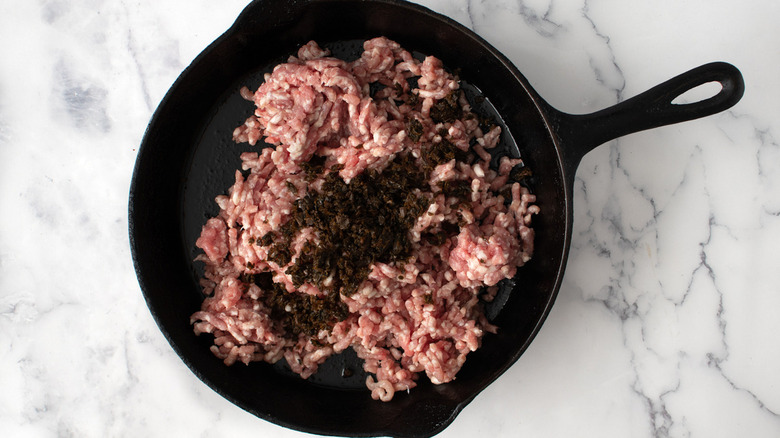 raw ground pork in pan