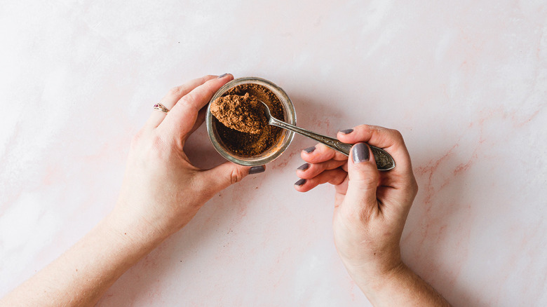 spoon of ground spice from jar