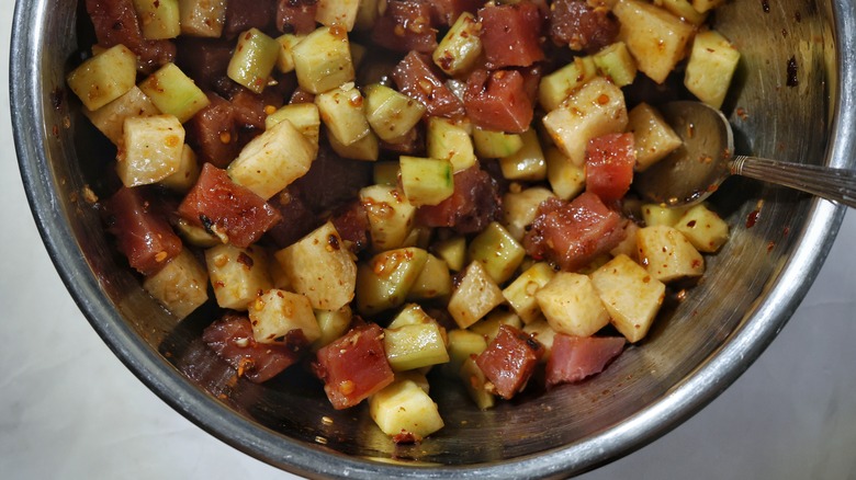 bowl of sauced tuna and vegetables