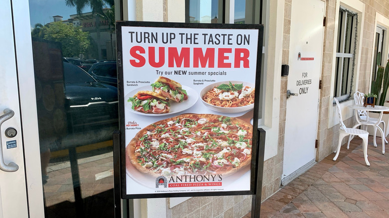 Sign outside Anthony's Coal Fired Pizza & Wings