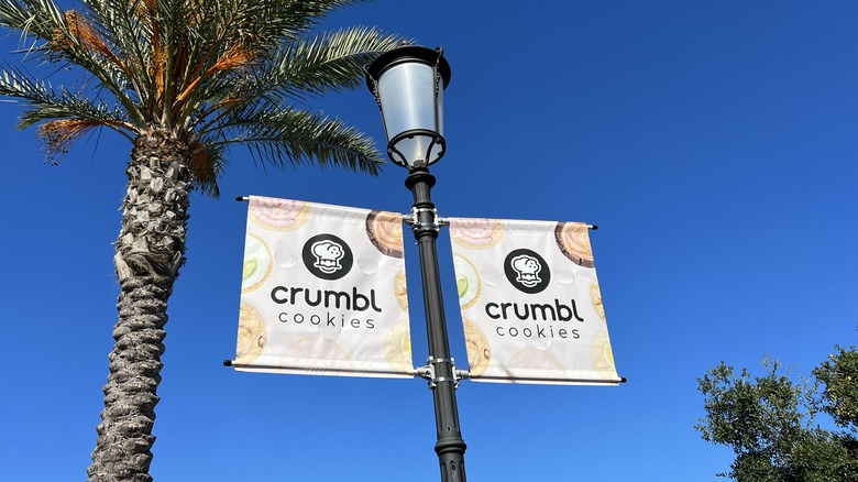 Crumbl Cookies signs on street lamp