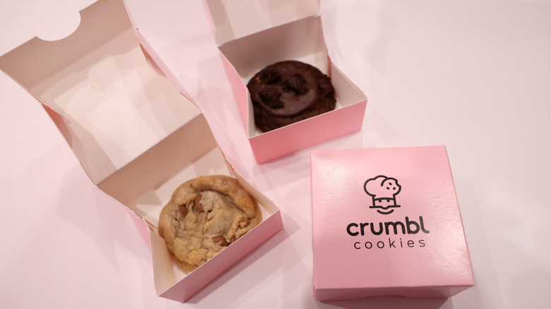 Crumbl Cookies in pink boxes