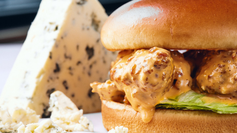 Burger with chicken and sauce, cheese block