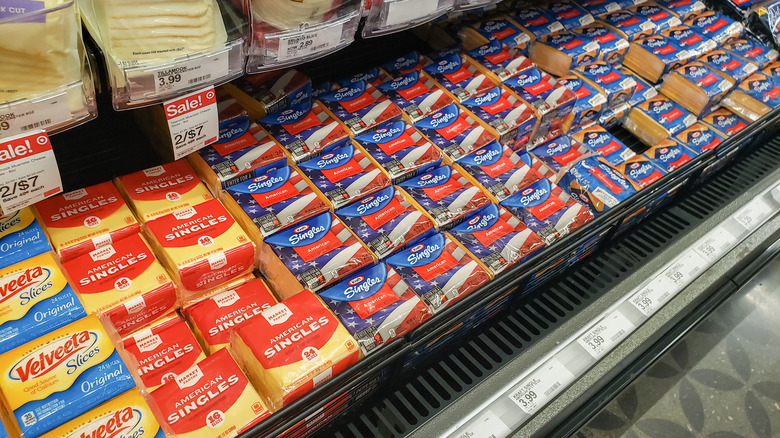 cheese in cooler at grocer