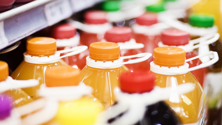 juice bottle tops on shelf