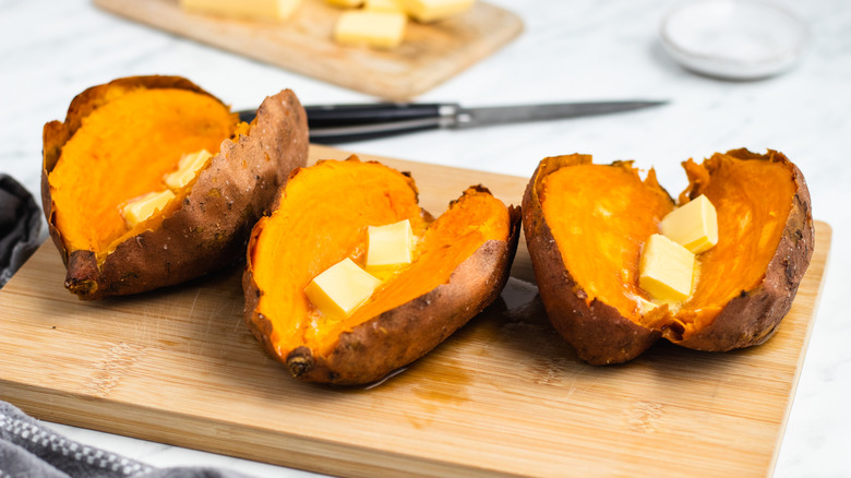 three sweet potatoes with butter