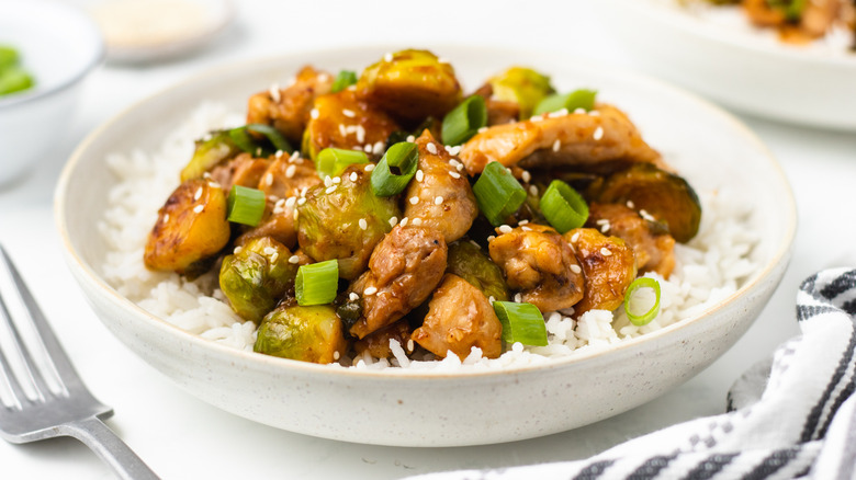 Chicken and Brussels sprouts stir fry in bowl